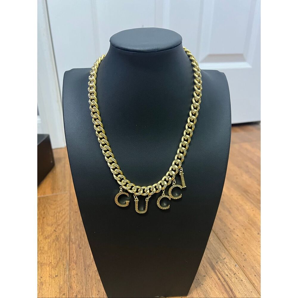 Gucci double gold tone script necklace & matching bracelet